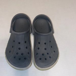 Gray Crocs with a green stripe kids size 12